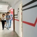 Ukrainian students walking down a corridor to their internships